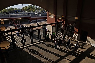 Fans file into Dickey-Stephens Park in North Little Rock for the Arkansas Travelers' home opener against the Springfield Cardinals on Friday, April 5, 2024. (Arkansas Democrat-Gazette/Colin Murphey)